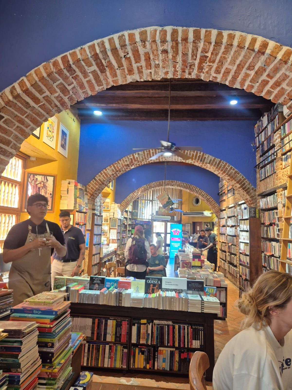 Ábaco Libros y Café — brick arches and floor-to-ceiling books, Centro Histórico