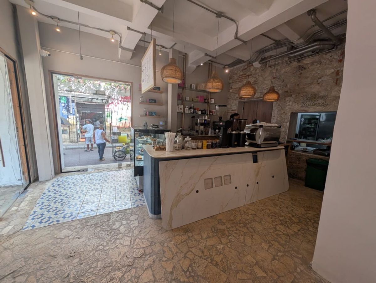 Libertario — bar and exposed stone wall